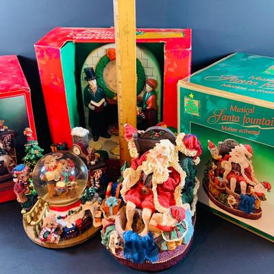 LOT 312: Collection of Holiday Home Decorations Including a Clock, Snow Globe and Fountian - All with Original Boxes