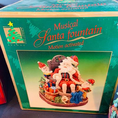 LOT 312: Collection of Holiday Home Decorations Including a Clock, Snow Globe and Fountian - All with Original Boxes