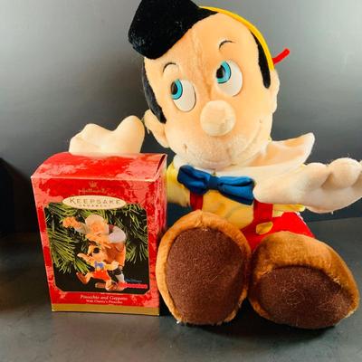 LOT 313: Disney Plushes Pinocchio and Goofy with Hallmark Ornaments- Pinocchio and Mother Goose and More