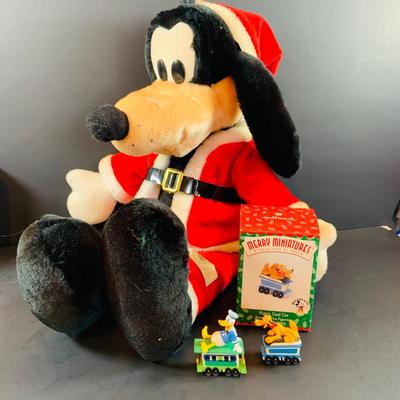 LOT 313: Disney Plushes Pinocchio and Goofy with Hallmark Ornaments- Pinocchio and Mother Goose and More