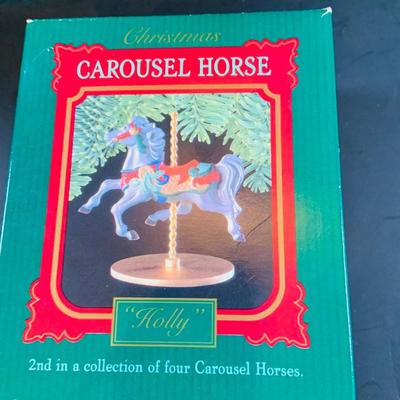 LOT314: Holiday Carousel Collection Including a Maisto Battery Powered Animated Musical Carousel, Hallmark Carousel Horse Ornaments and...
