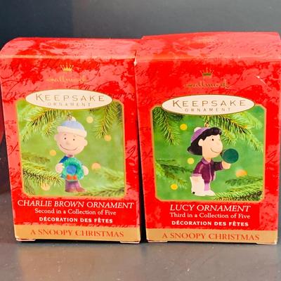 LOT 323: Large Assortment of Hallmark Christmas Ornaments Including I Love Lucy, Peanuts, It's a Wonderful Life and Many More