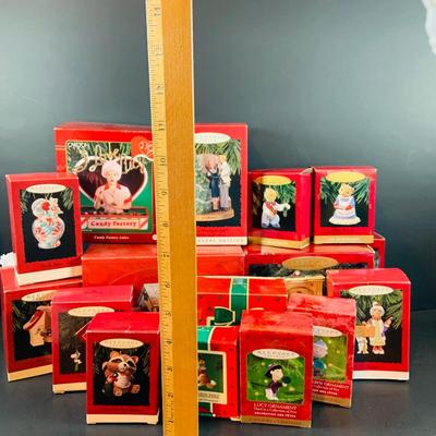 LOT 323: Large Assortment of Hallmark Christmas Ornaments Including I Love Lucy, Peanuts, It's a Wonderful Life and Many More