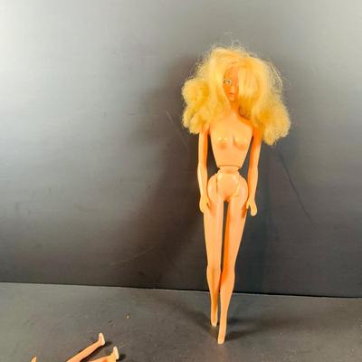 LOT 355: Vintage 1963 World of Barbie Doll Case with Dolls and Clothing.