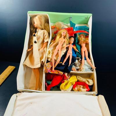 LOT 355: Vintage 1963 World of Barbie Doll Case with Dolls and Clothing.
