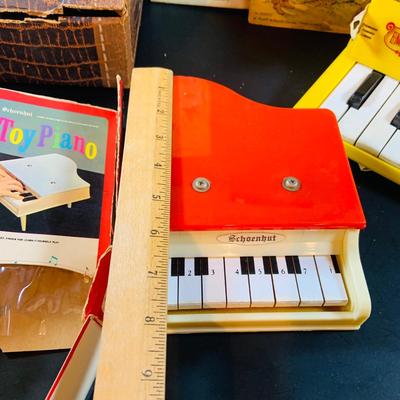 LOT 357: Vintage Childrens Toys, Games, and Books Including a Toy Piano and Ememee Toy Accordion
