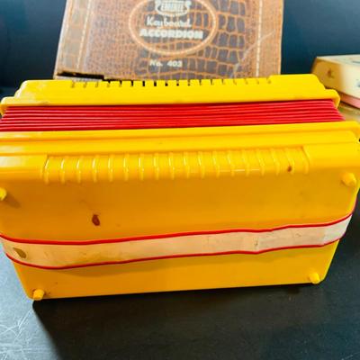 LOT 357: Vintage Childrens Toys, Games, and Books Including a Toy Piano and Ememee Toy Accordion