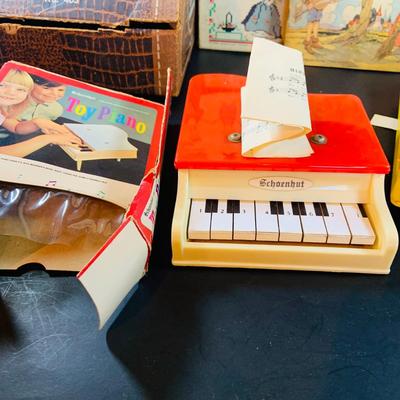 LOT 357: Vintage Childrens Toys, Games, and Books Including a Toy Piano and Ememee Toy Accordion