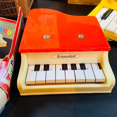 LOT 357: Vintage Childrens Toys, Games, and Books Including a Toy Piano and Ememee Toy Accordion