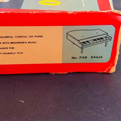 LOT 357: Vintage Childrens Toys, Games, and Books Including a Toy Piano and Ememee Toy Accordion