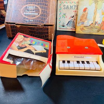 LOT 357: Vintage Childrens Toys, Games, and Books Including a Toy Piano and Ememee Toy Accordion