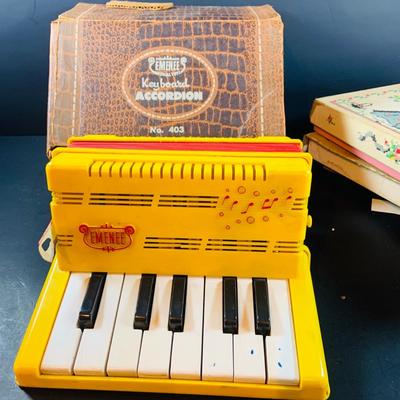 LOT 357: Vintage Childrens Toys, Games, and Books Including a Toy Piano and Ememee Toy Accordion