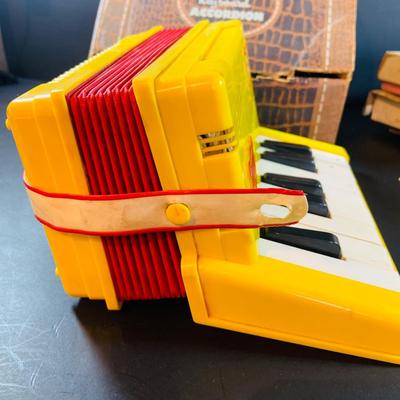 LOT 357: Vintage Childrens Toys, Games, and Books Including a Toy Piano and Ememee Toy Accordion