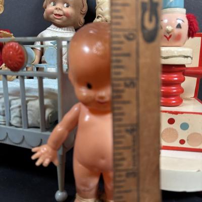 LOT 406: Vintage Doll Collection: Irwin Kewpie Doll, Plastic Doll w/Sleepy Eyes, Blue Doll Crib, Rubber Salvation Army Doll, Squeaky...