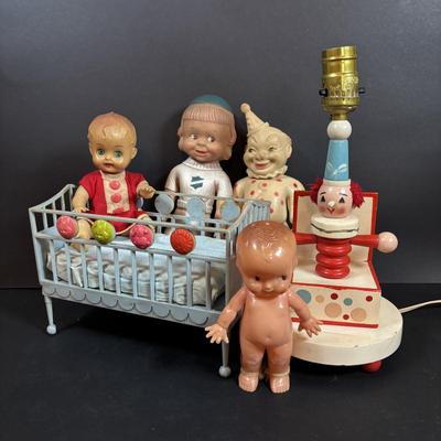 LOT 406: Vintage Doll Collection: Irwin Kewpie Doll, Plastic Doll w/Sleepy Eyes, Blue Doll Crib, Rubber Salvation Army Doll, Squeaky...