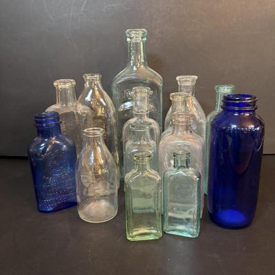 LOT 412: Vintage/Antique Bottles: McCormick, Hoods Sarsaparilla, Hires Household & More