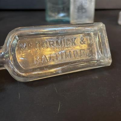 LOT 412: Vintage/Antique Bottles: McCormick, Hoods Sarsaparilla, Hires Household & More