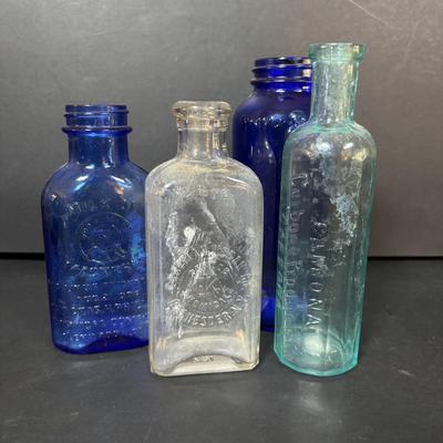 LOT 412: Vintage/Antique Bottles: McCormick, Hoods Sarsaparilla, Hires Household & More