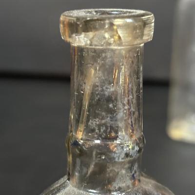 LOT 412: Vintage/Antique Bottles: McCormick, Hoods Sarsaparilla, Hires Household & More