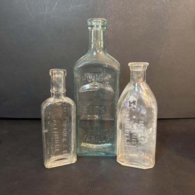 LOT 412: Vintage/Antique Bottles: McCormick, Hoods Sarsaparilla, Hires Household & More