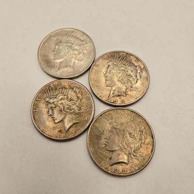 LOT 101J: 4 1923 Peace Silver Dollars