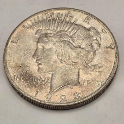 LOT 101J: 4 1923 Peace Silver Dollars