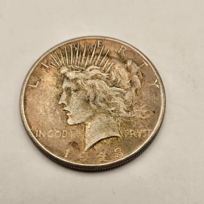 LOT 101J: 4 1923 Peace Silver Dollars
