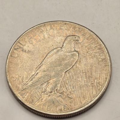LOT 101J: 4 1923 Peace Silver Dollars
