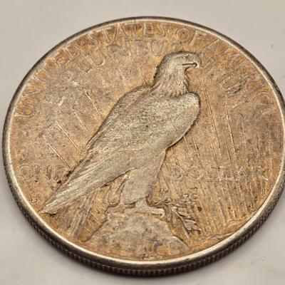 LOT 101J: 4 1923 Peace Silver Dollars