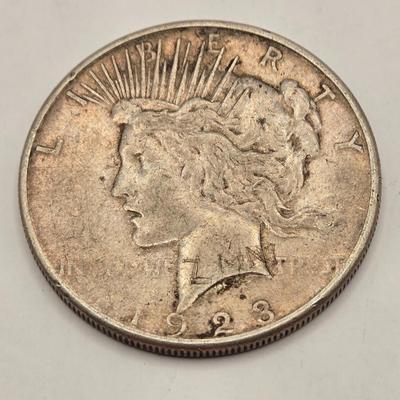 LOT 101J: 4 1923 Peace Silver Dollars