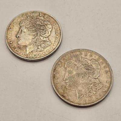 LOT 106J: Two 1921 Morgan Silver Dollars/ No Mint Mark Philadelphia