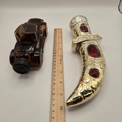 LOT 114K: Two Piggy Banks, Avon Cologne Decanters, & Small Replica of English Field Gun