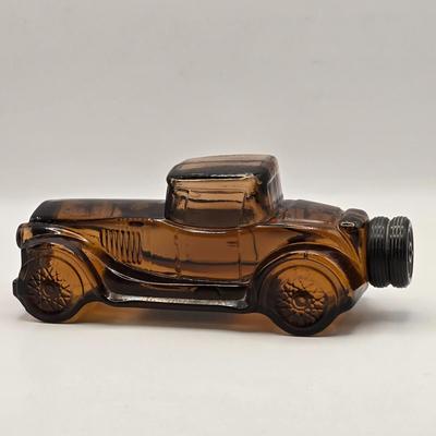 LOT 114K: Two Piggy Banks, Avon Cologne Decanters, & Small Replica of English Field Gun