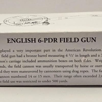 LOT 114K: Two Piggy Banks, Avon Cologne Decanters, & Small Replica of English Field Gun