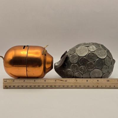 LOT 114K: Two Piggy Banks, Avon Cologne Decanters, & Small Replica of English Field Gun