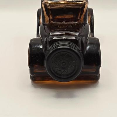 LOT 114K: Two Piggy Banks, Avon Cologne Decanters, & Small Replica of English Field Gun