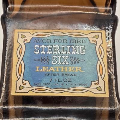 LOT 114K: Two Piggy Banks, Avon Cologne Decanters, & Small Replica of English Field Gun