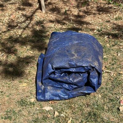 LARGE BLUE TARP AND SOME YARD DECOR