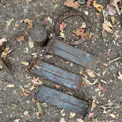 IRON WEDGES, RUSTIC LOOKING FORKS, A HORSE SHOE AND A BAR STOOL