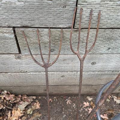 IRON WEDGES, RUSTIC LOOKING FORKS, A HORSE SHOE AND A BAR STOOL