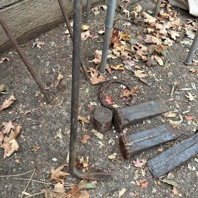 IRON WEDGES, RUSTIC LOOKING FORKS, A HORSE SHOE AND A BAR STOOL