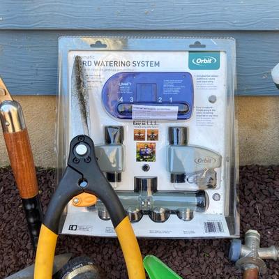 LOT 36G: Lawn and Garden Collection - Orbit Lawn Watering System in Package, Garden Tools, Wooden Hose Holder and More