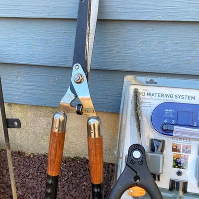LOT 36G: Lawn and Garden Collection - Orbit Lawn Watering System in Package, Garden Tools, Wooden Hose Holder and More