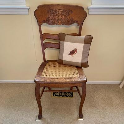 LOT 244 Z: Vintage Hand Carved Cane Seat Chair & Cross Stitched Pillow