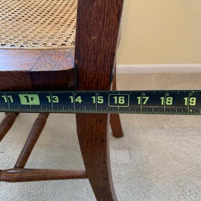 LOT 244 Z: Vintage Hand Carved Cane Seat Chair & Cross Stitched Pillow