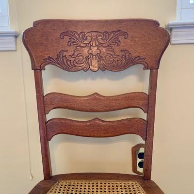 LOT 244 Z: Vintage Hand Carved Cane Seat Chair & Cross Stitched Pillow
