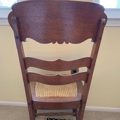 LOT 244 Z: Vintage Hand Carved Cane Seat Chair & Cross Stitched Pillow