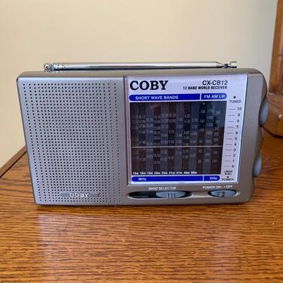 LOT 249 Z: RCA CD Player Clock Radio Model #RP3751A, Coby 12 Band World Receiver Model #CX-CB12, & Radio Shack Handheld AM/FM Radio