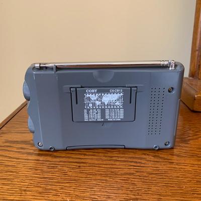 LOT 249 Z: RCA CD Player Clock Radio Model #RP3751A, Coby 12 Band World Receiver Model #CX-CB12, & Radio Shack Handheld AM/FM Radio