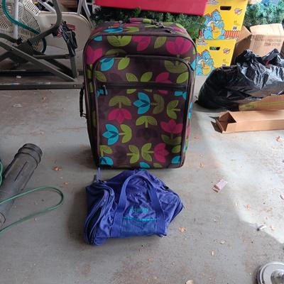 LARGE CLOTH SUITCASE ON 2 WHEELS AND A SMALLER DUFFLE BAG